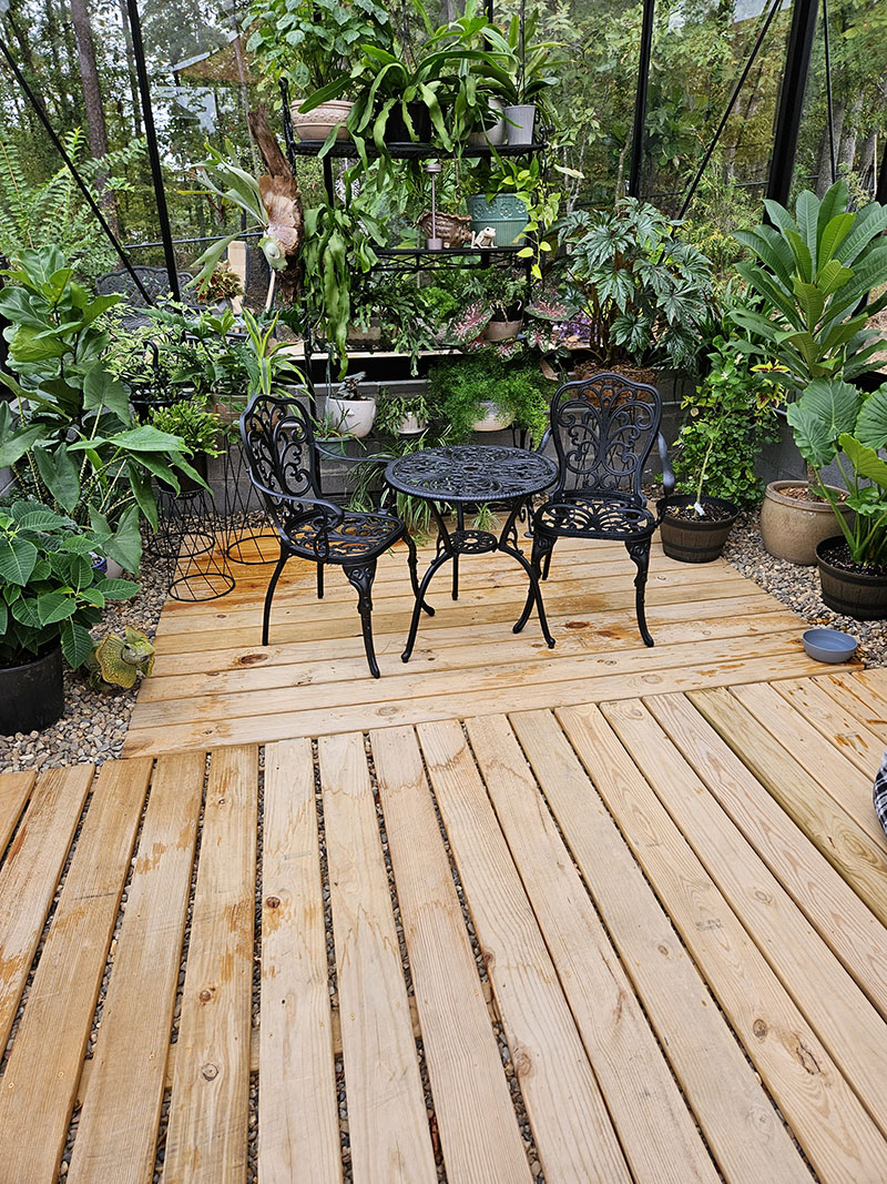 photo two royal victorian greenhouse with owner modifications including awning