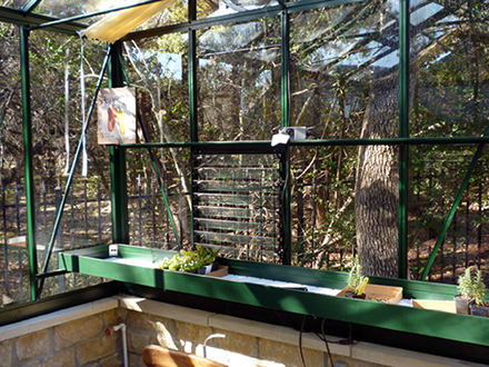 inside view including shade cover, shelving and louvered window