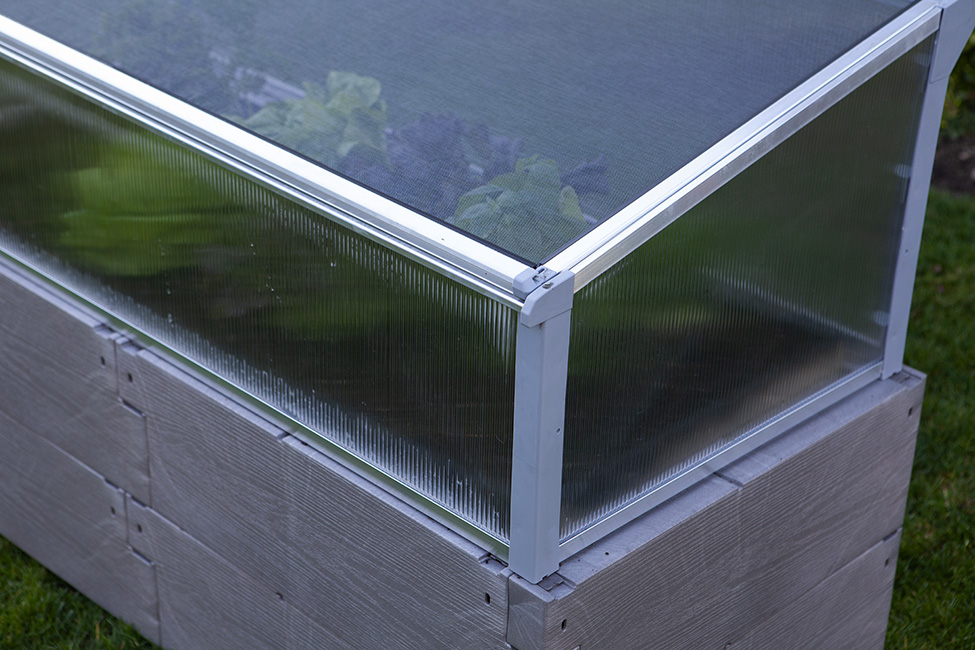 gray timber raised bed with cold frame lower corner view