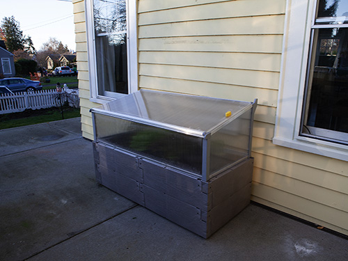 gray timber raised bedagainst house