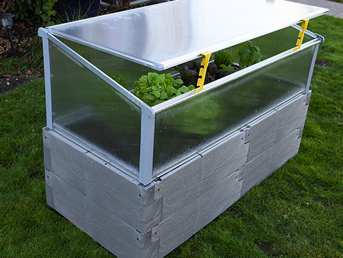 gray timber raised bed with cold frame using openers